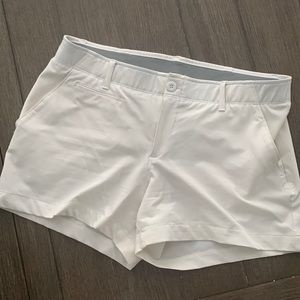 Under Armor size 12. Fast drying fitted white shorts